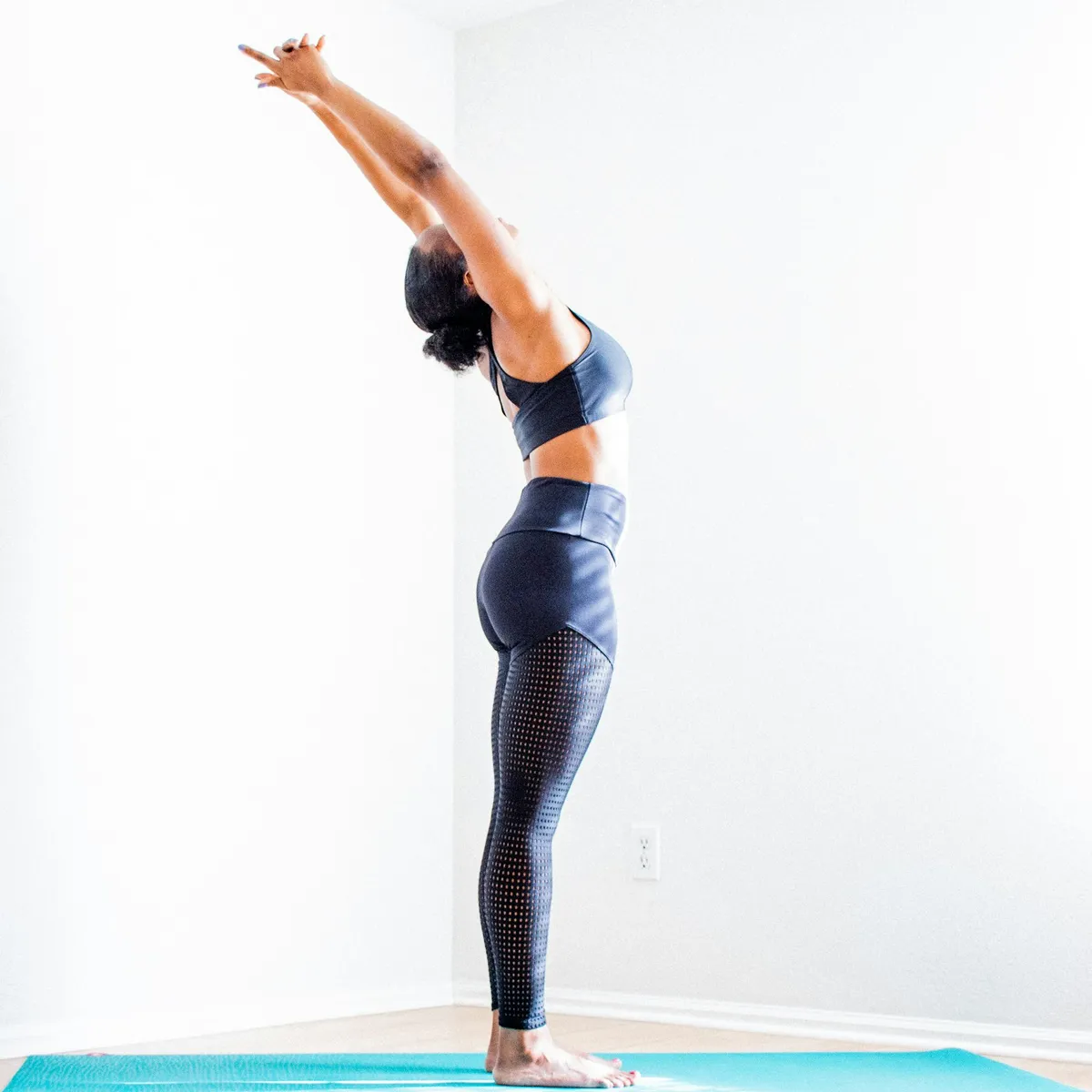 Yoga student performing a standing backbend